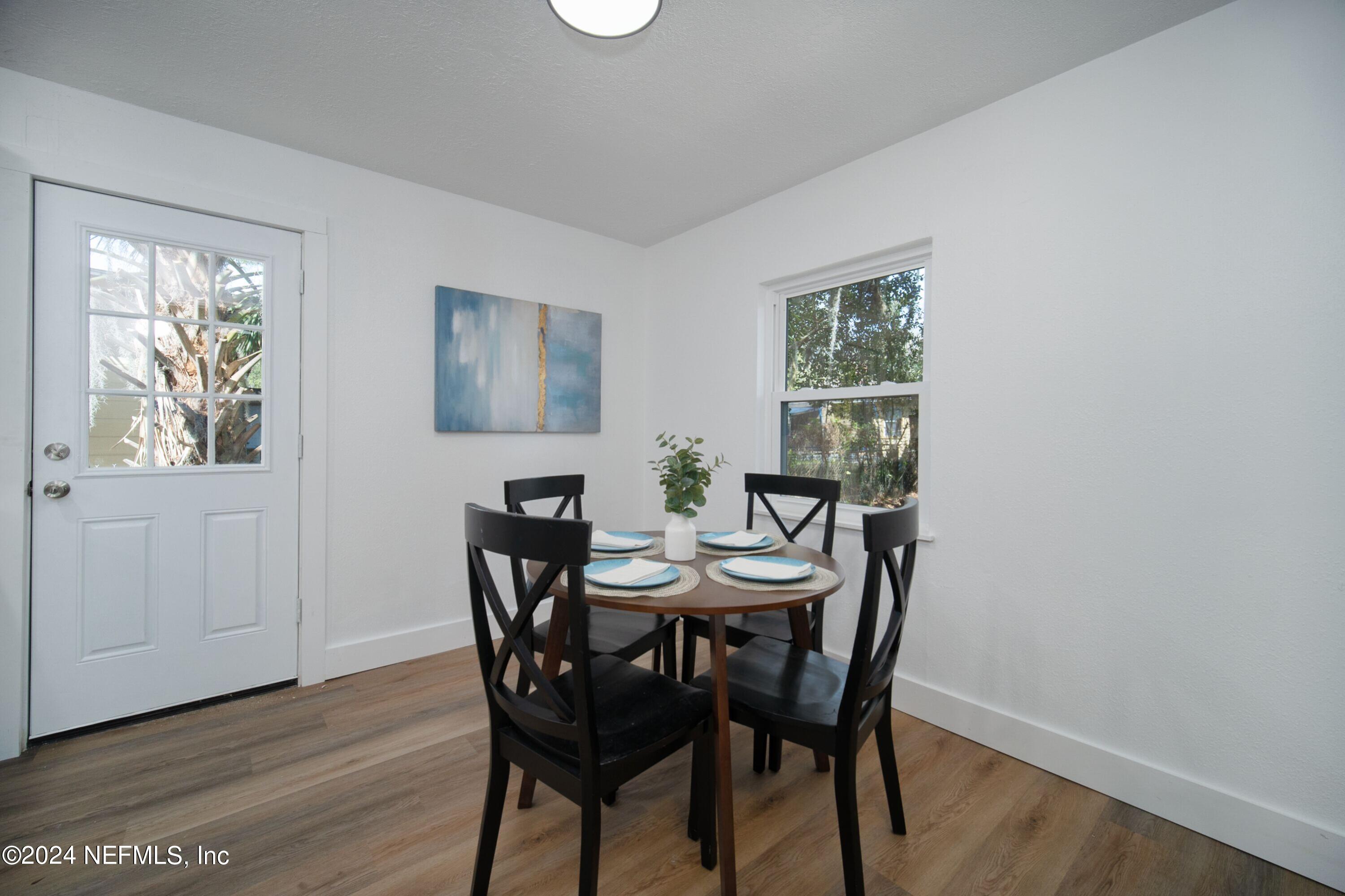 2589 Springmont Street Jacksonville, FL 32207 - Photo 23 of 71 a view of a dining room with furniture window and wooden floor