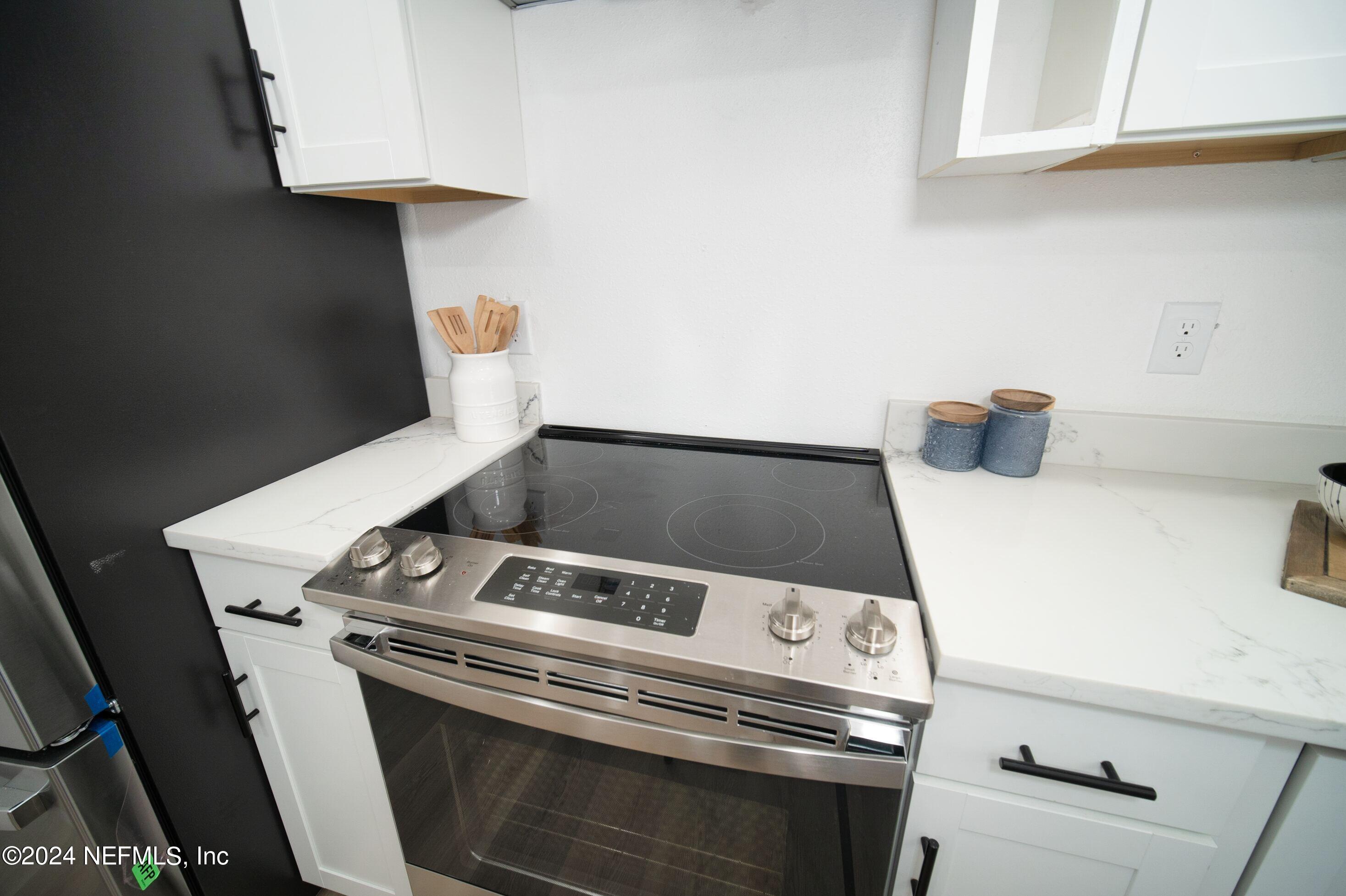 2589 Springmont Street Jacksonville, FL 32207 - Photo 28 of 71 a close up of a stove top oven sitting inside of a kitchen