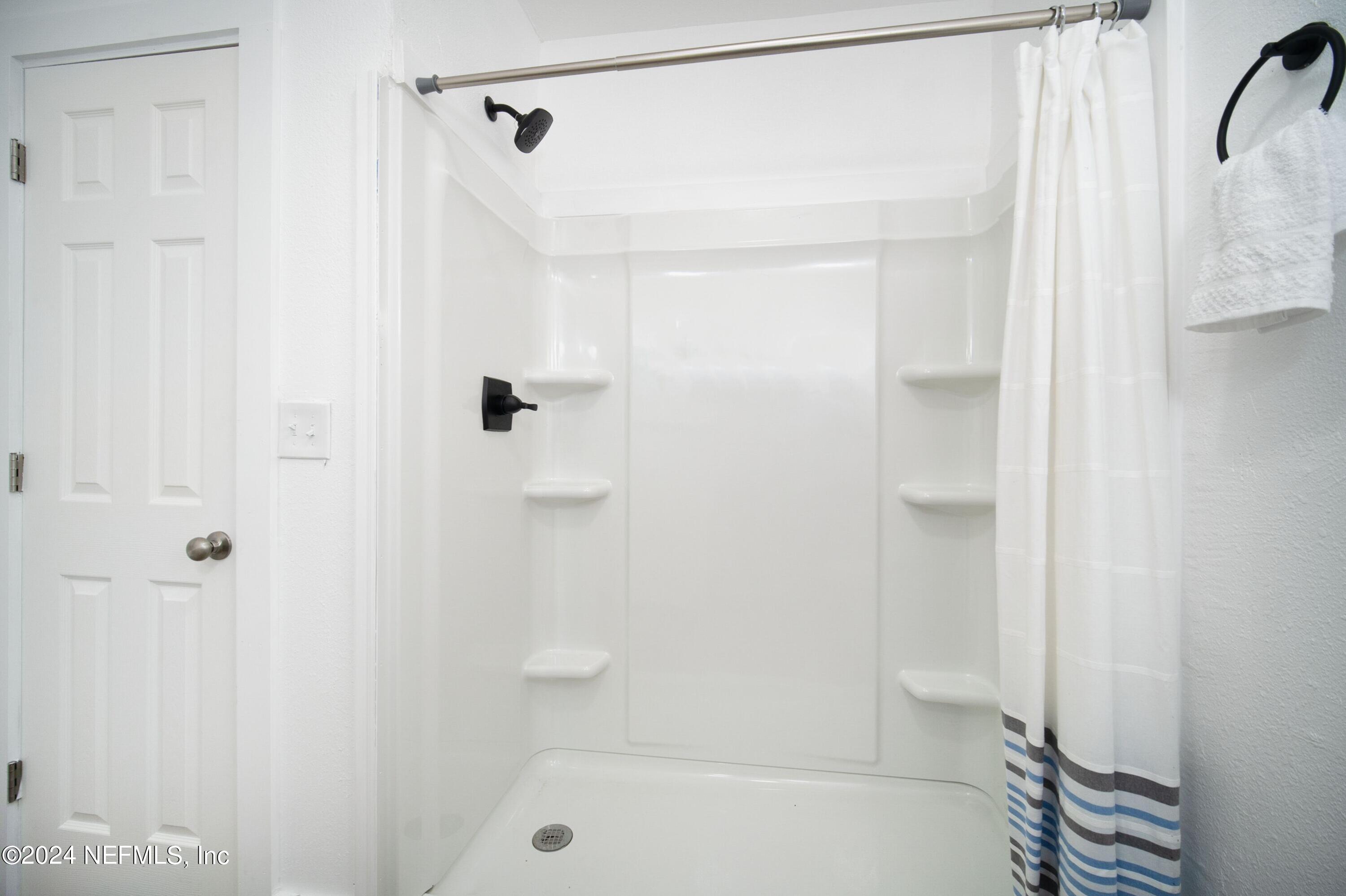 2589 Springmont Street Jacksonville, FL 32207 - Photo 41 of 71 a bathroom with a shower