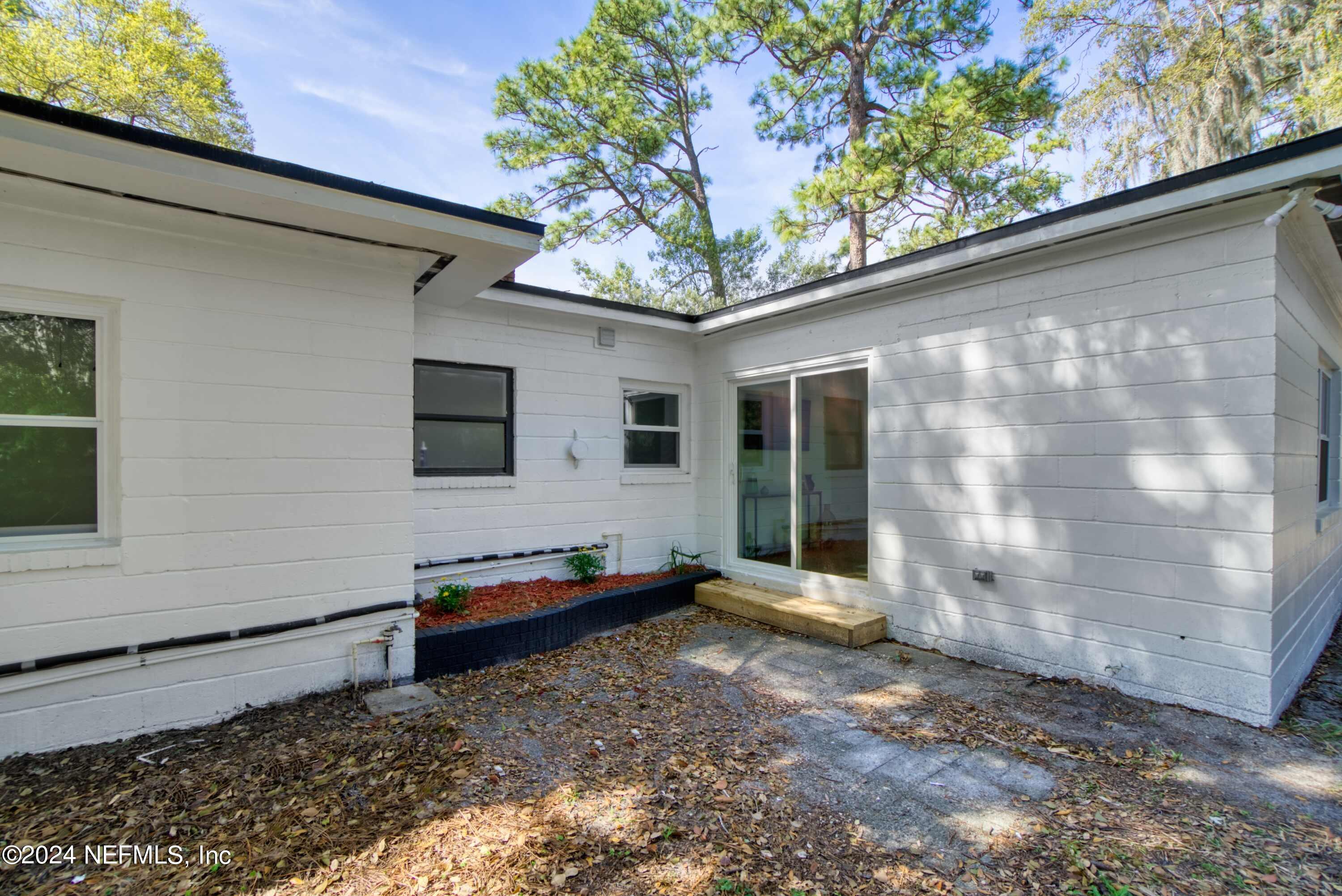 2589 Springmont Street Jacksonville, FL 32207 - Photo 52 of 71 a front view of a house with a yard