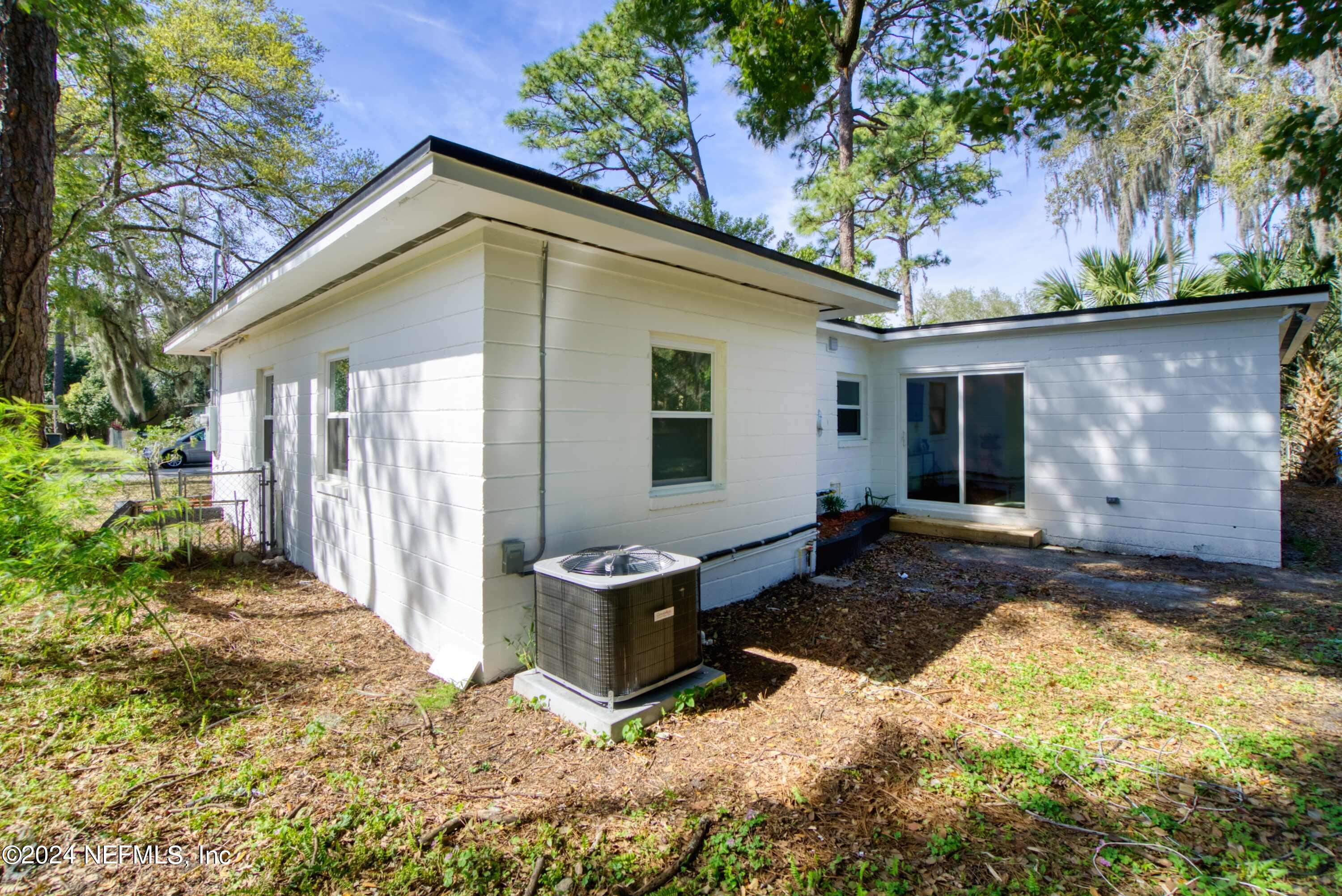 2589 Springmont Street Jacksonville, FL 32207 - Photo 53 of 71 a backyard of a house with yard and outdoor seating