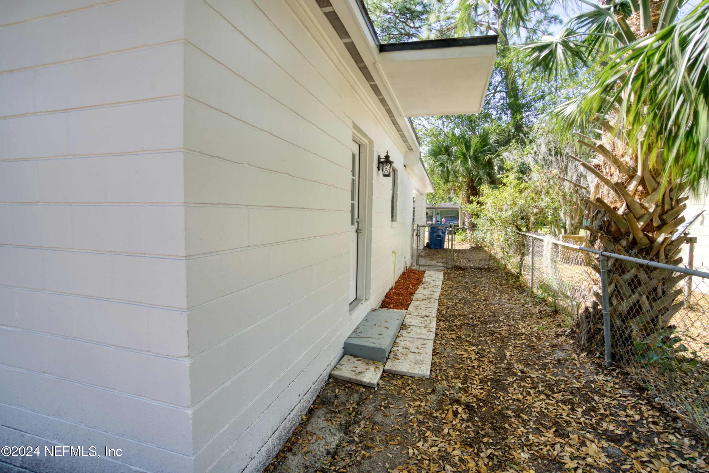 2589 Springmont Street Jacksonville, FL 32207 - Photo 58 of 71 a view of a pathway of a house with a yard