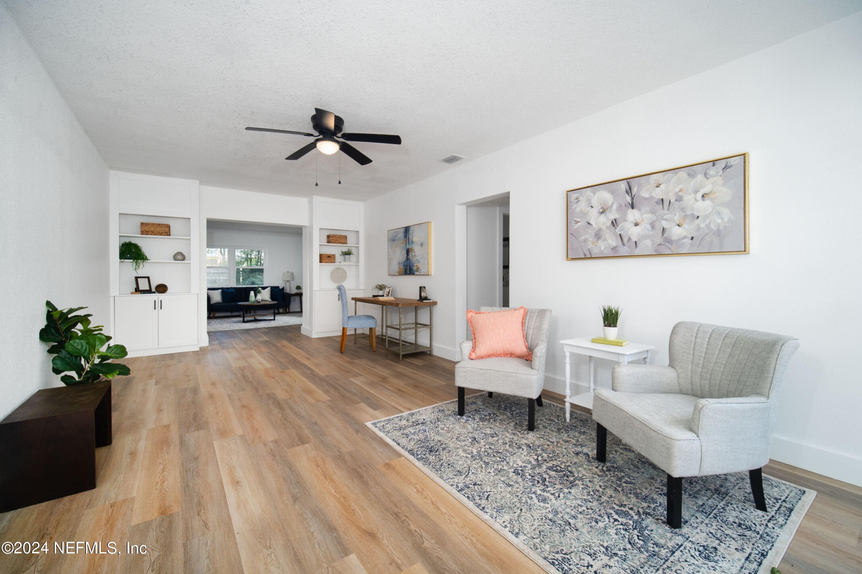 2589 Springmont Street Jacksonville, FL 32207 - Photo 8 of 71 a living room with furniture and wooden floor