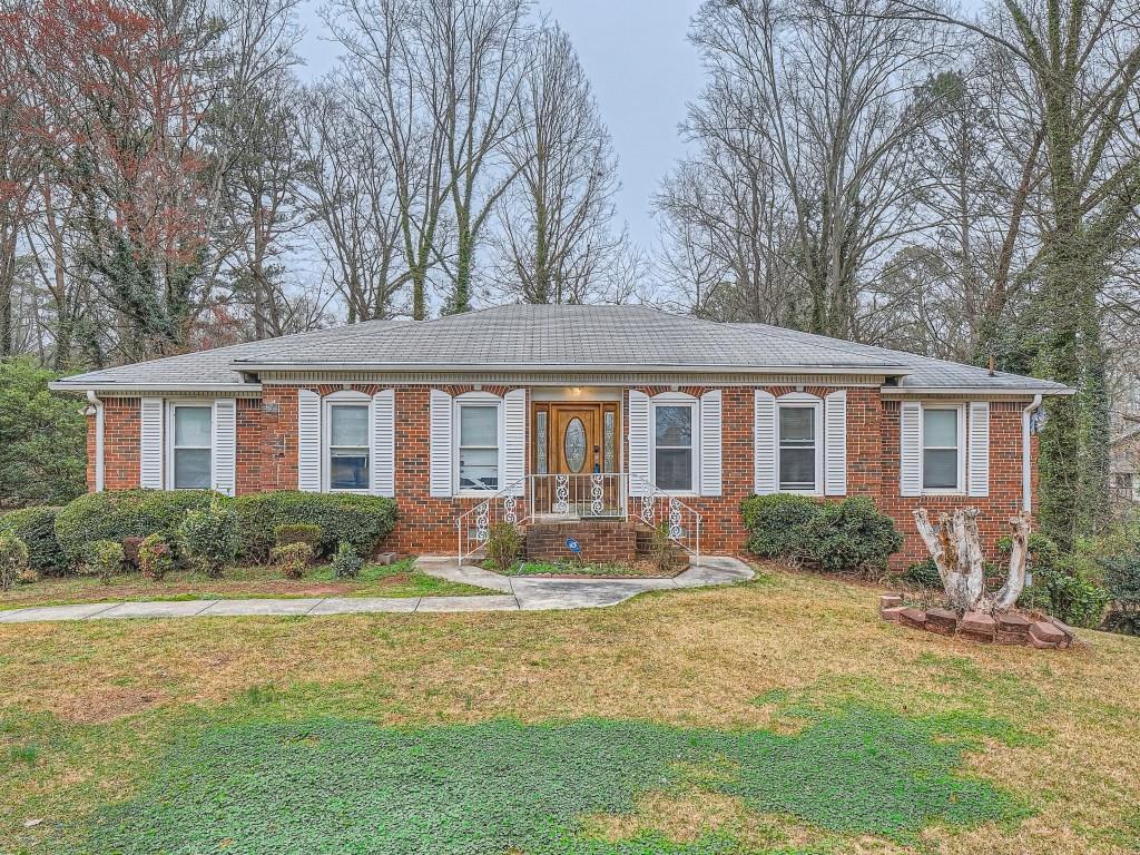 3646 Rainbow Drive Decatur, GA 30034 - Photo 1 of 1 a front view of a house with yard and green space