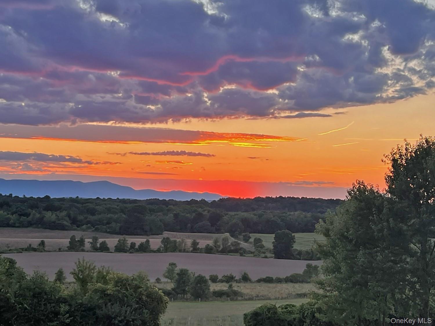 387 Tishauser Road Hudson, NY 12534 - Photo 18 of 20 a view of a city with sunset view
