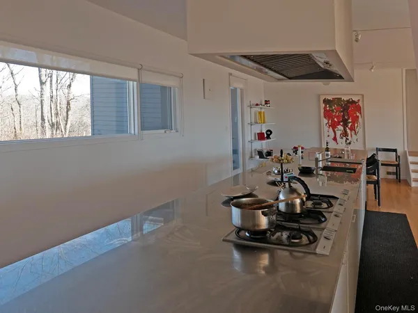 a room with gym equipment and a large window