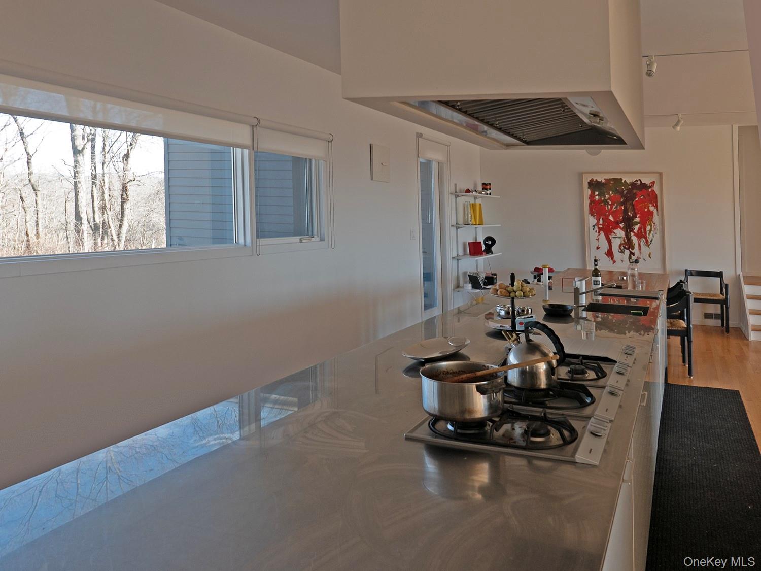 387 Tishauser Road Hudson, NY 12534 - Photo 6 of 20 a room with gym equipment and a large window