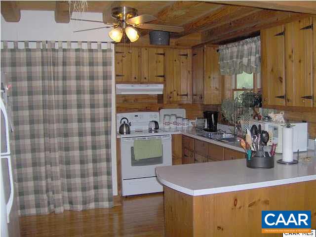 6037 Bell Road Dillwyn, VA 23936 - Photo 6 of 8 a kitchen with a sink a stove and cabinets