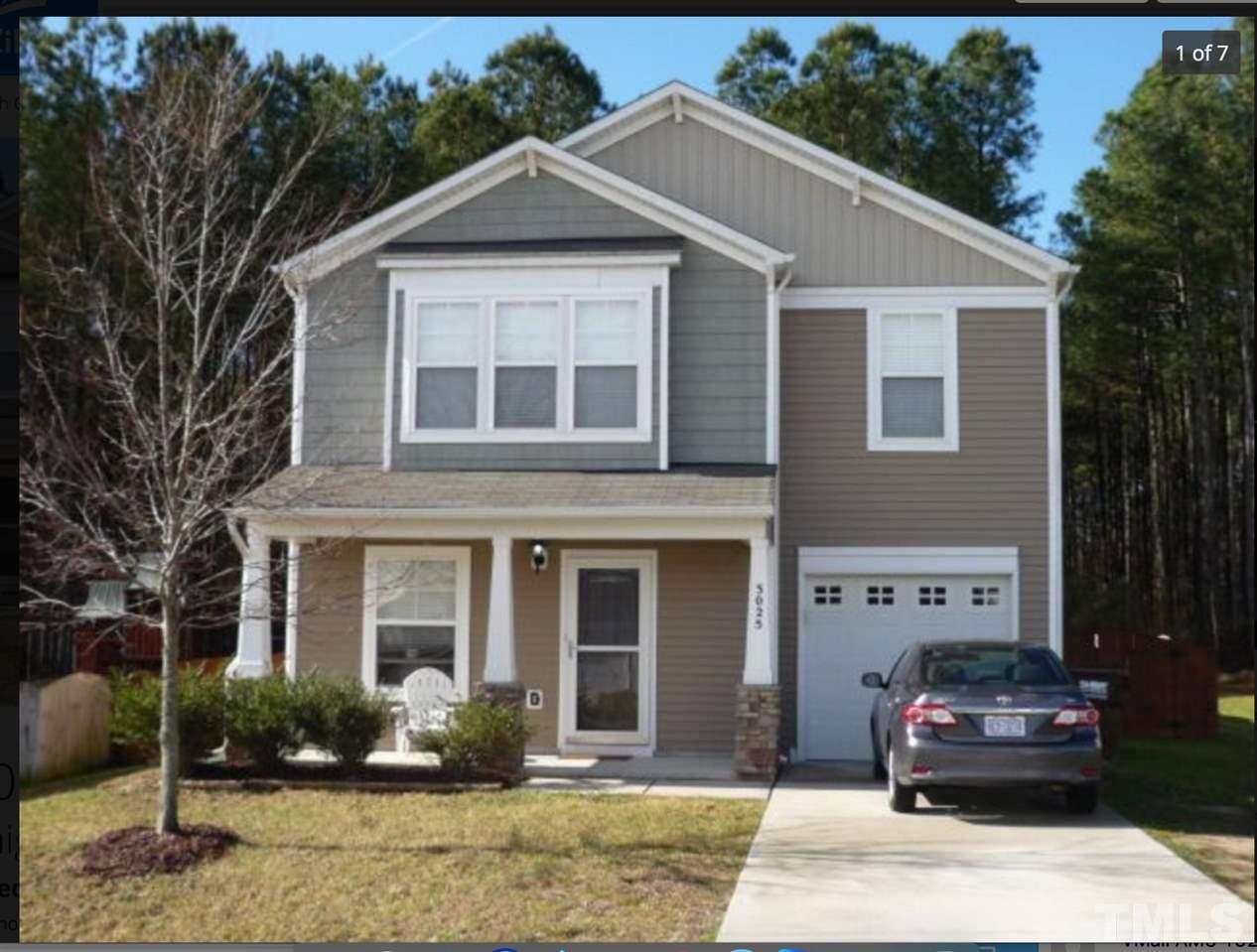 3025 Varcroft Road Knightdale, NC 27545 - Photo 1 of 7 a front view of a house with garden