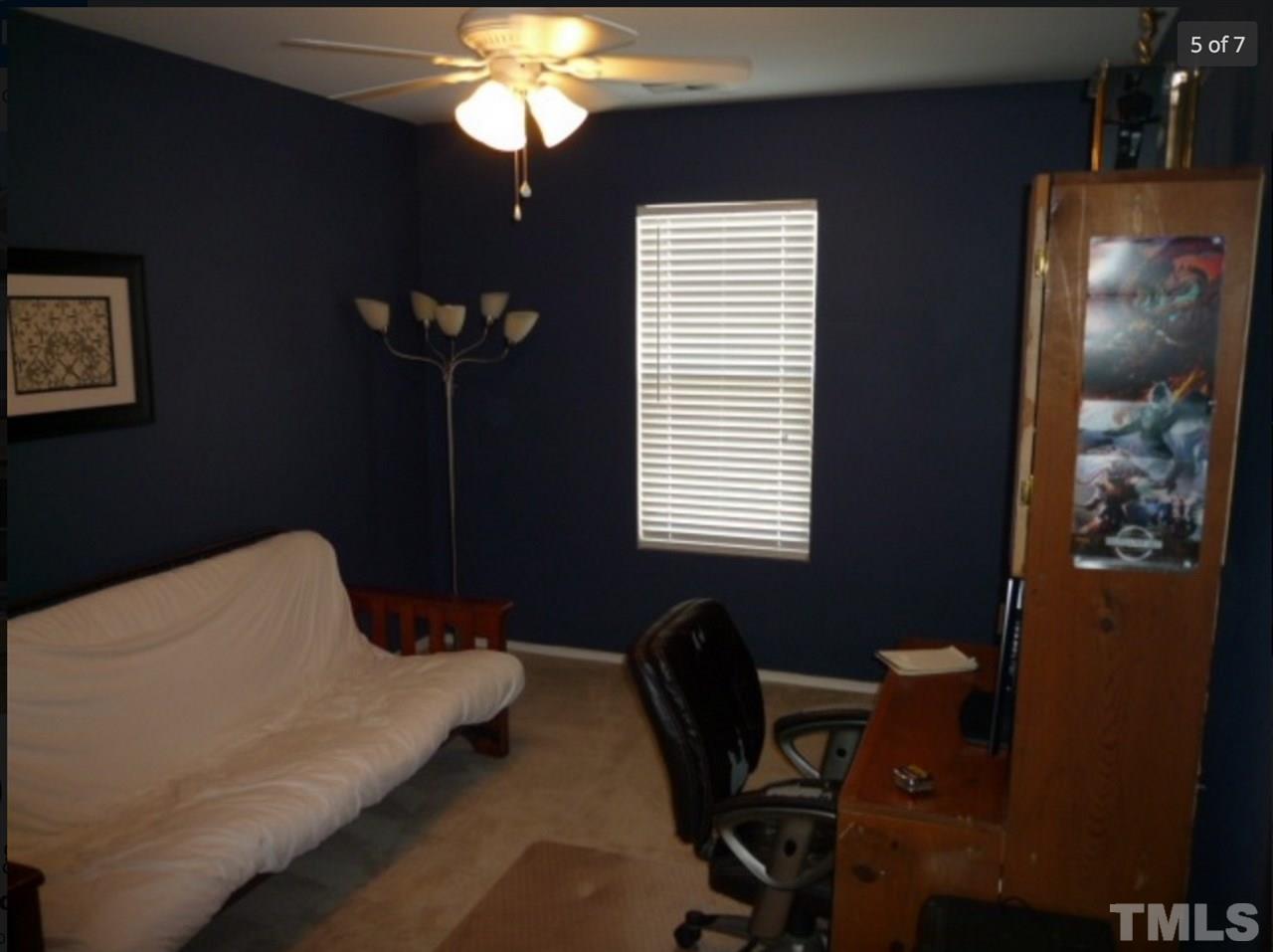 3025 Varcroft Road Knightdale, NC 27545 - Photo 5 of 7 a bedroom with a bed and a window