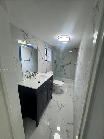a bathroom with a sink and mirror