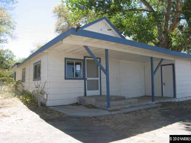 6050 Power Line Road Fallon, NV 89406 - Photo 8 of 13 a view of a house with a yard