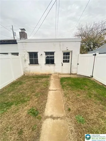 a view of a backyard of the house