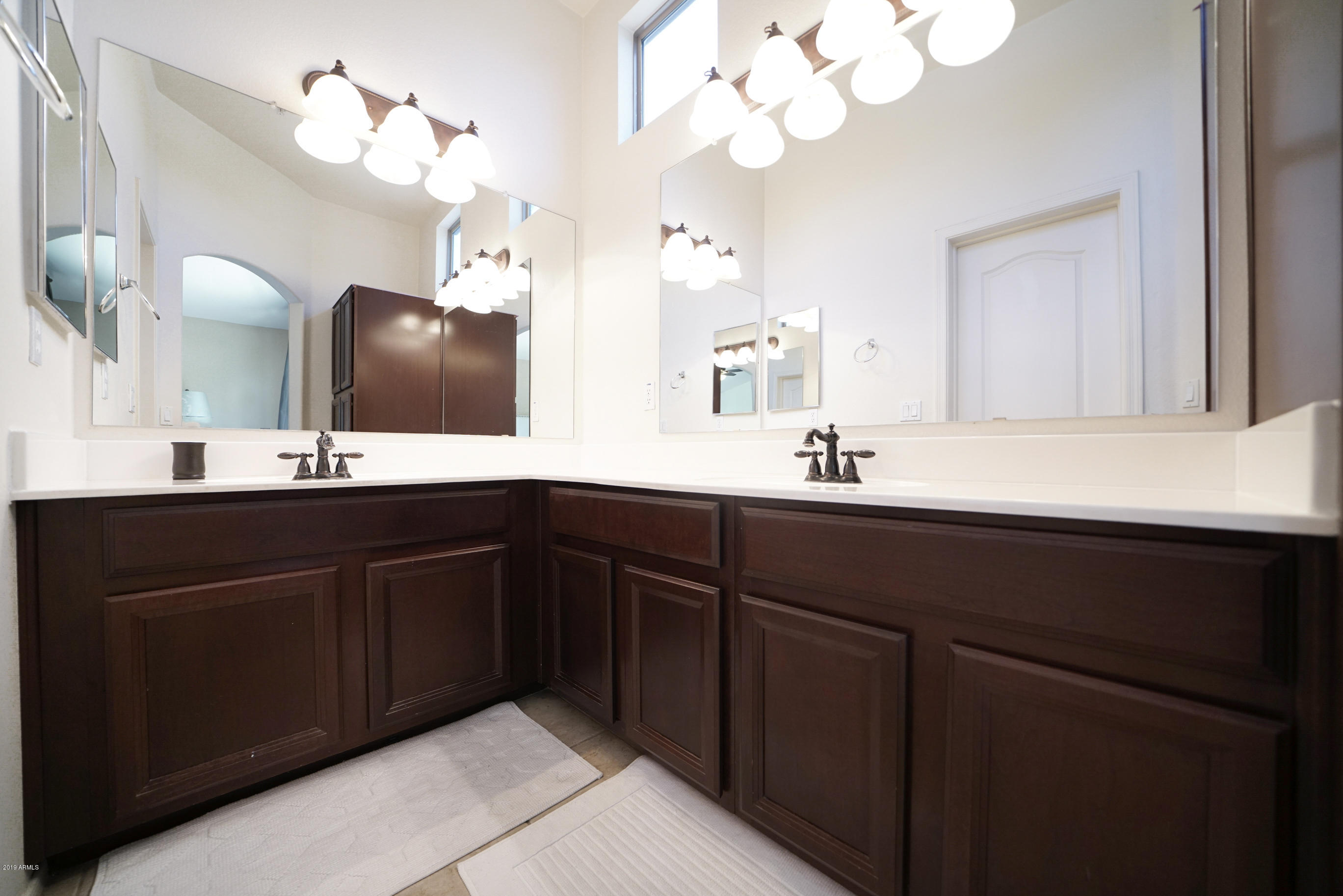 280 South Evergreen Road, Unit 1229 Tempe, AZ 85288 - Photo 14 of 31 a bathroom with a sink vanity and a mirror