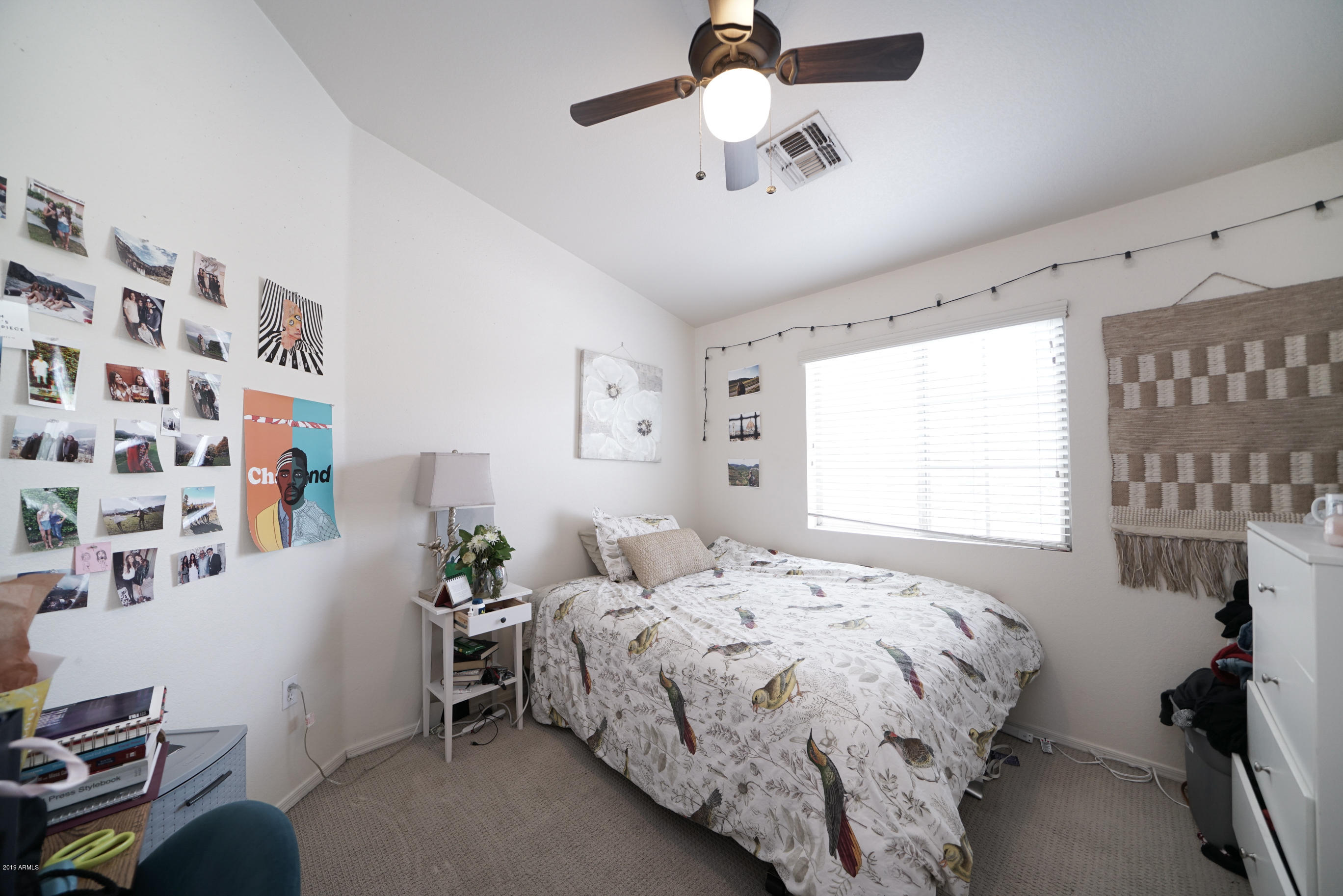 280 South Evergreen Road, Unit 1229 Tempe, AZ 85288 - Photo 21 of 31 a bedroom with a bed and a chandelier