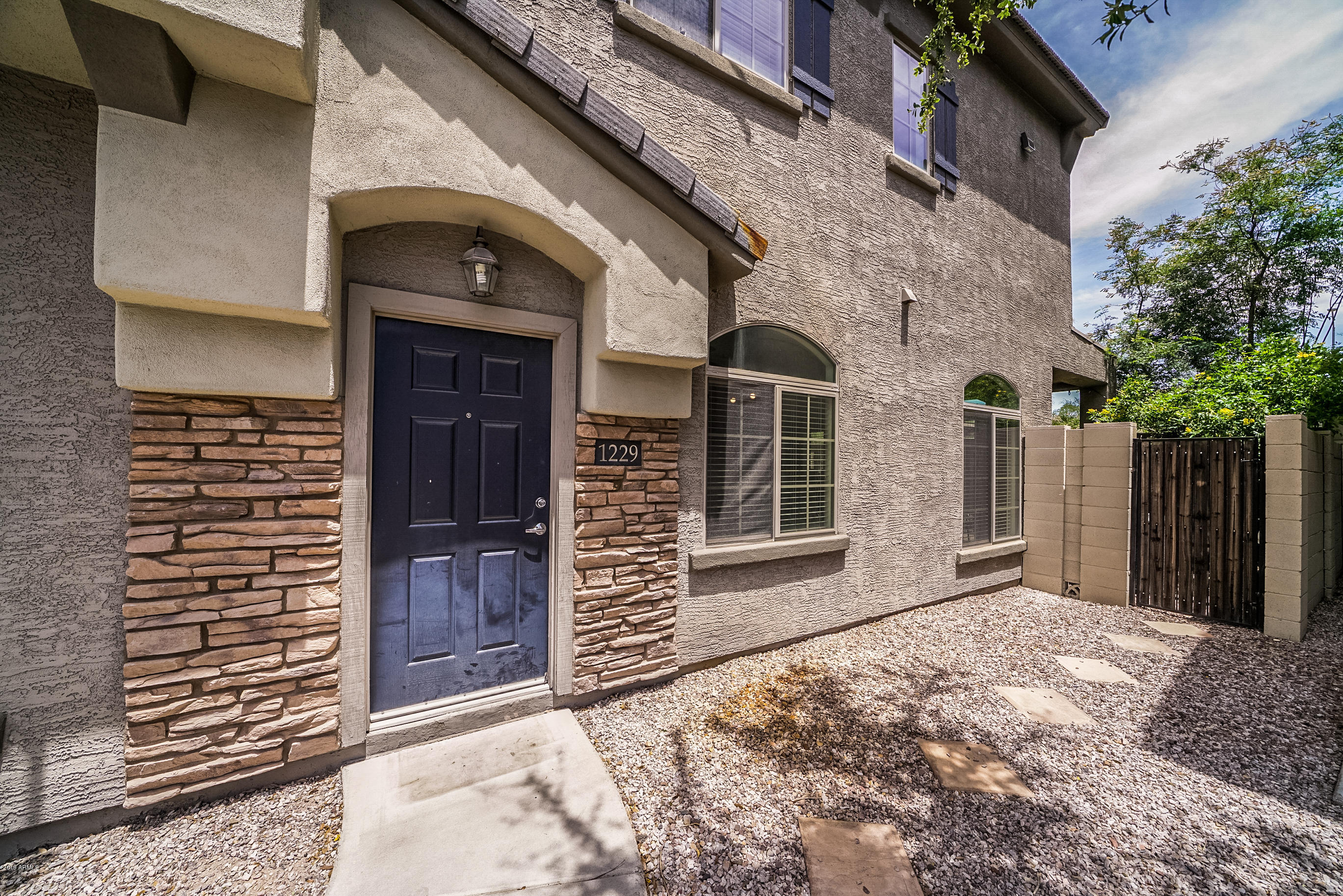 280 South Evergreen Road, Unit 1229 Tempe, AZ 85288 - Photo 29 of 31 a view of entrance gate of a house