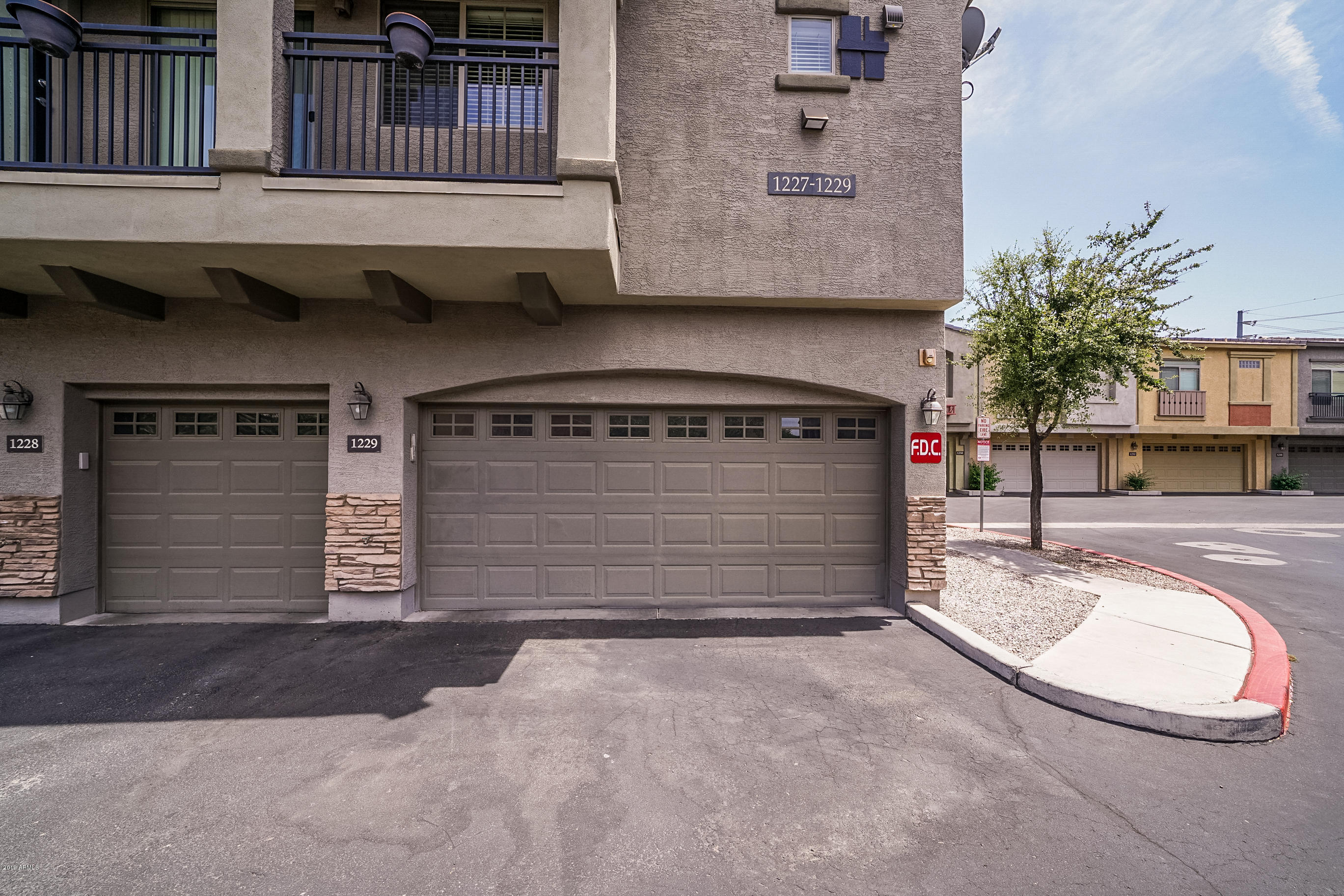 280 South Evergreen Road, Unit 1229 Tempe, AZ 85288 - Photo 30 of 31 front view of a house with a garage