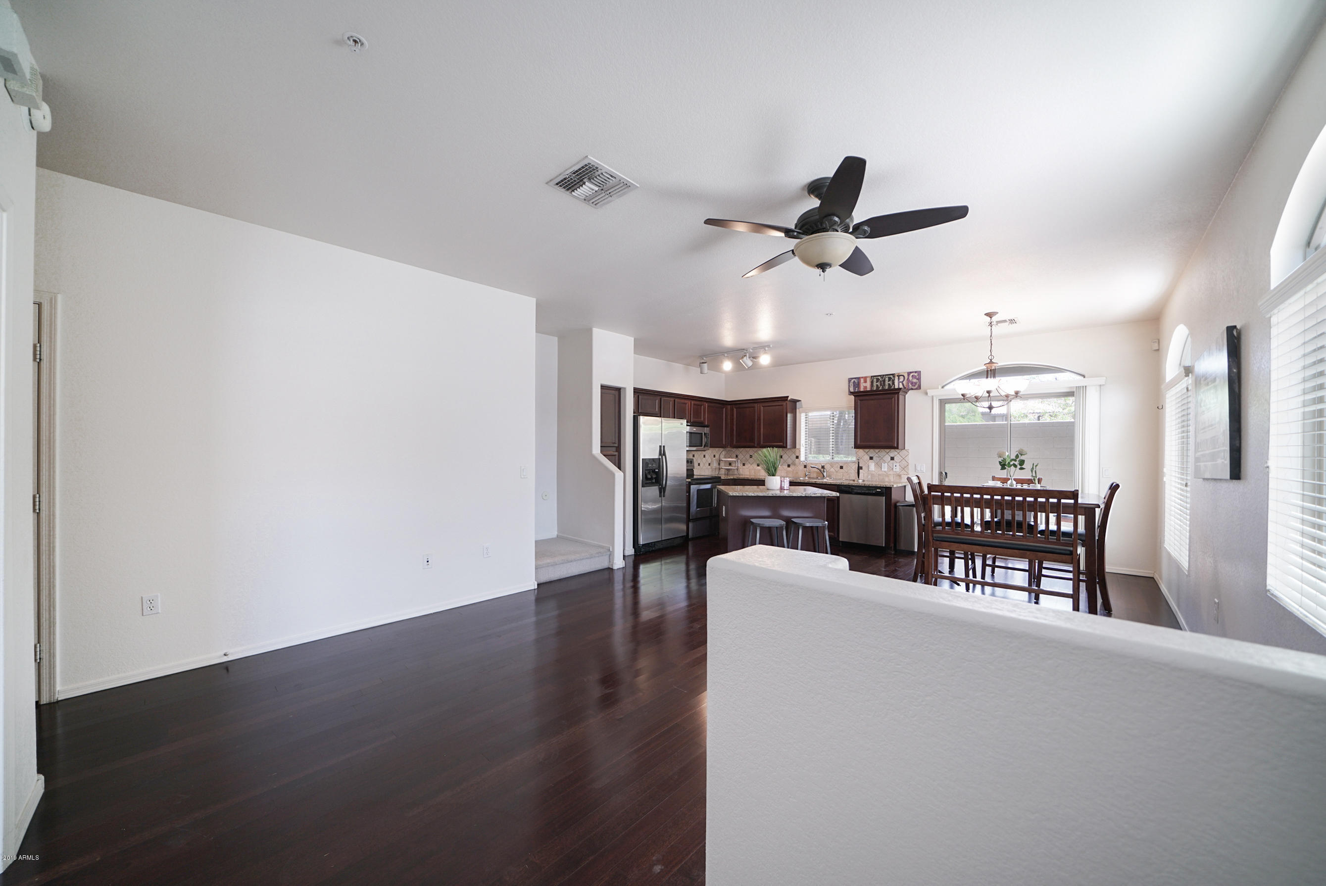 280 South Evergreen Road, Unit 1229 Tempe, AZ 85288 - Photo 4 of 31 a view of a livingroom with furniture and a ceiling fan