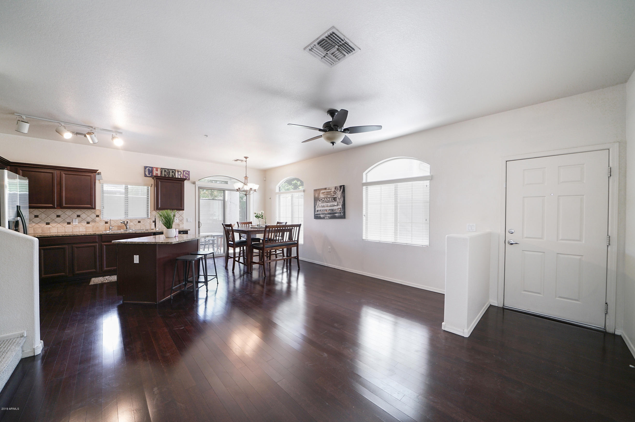 280 South Evergreen Road, Unit 1229 Tempe, AZ 85288 - Photo 5 of 31 a view of a kitchen with workspace and wooden floor