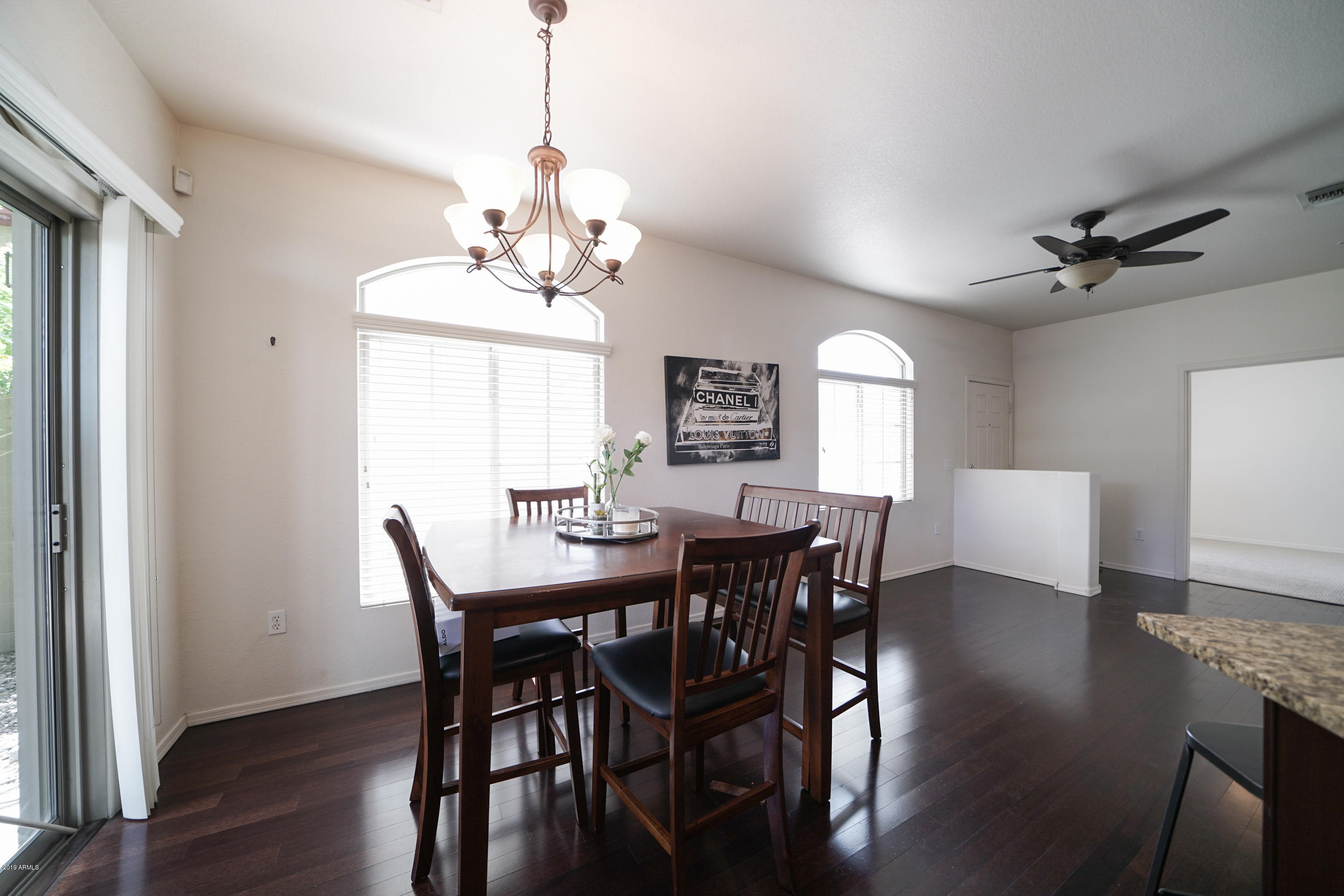 280 South Evergreen Road, Unit 1229 Tempe, AZ 85288 - Photo 9 of 31 a view of a dining room with furniture window and wooden floor