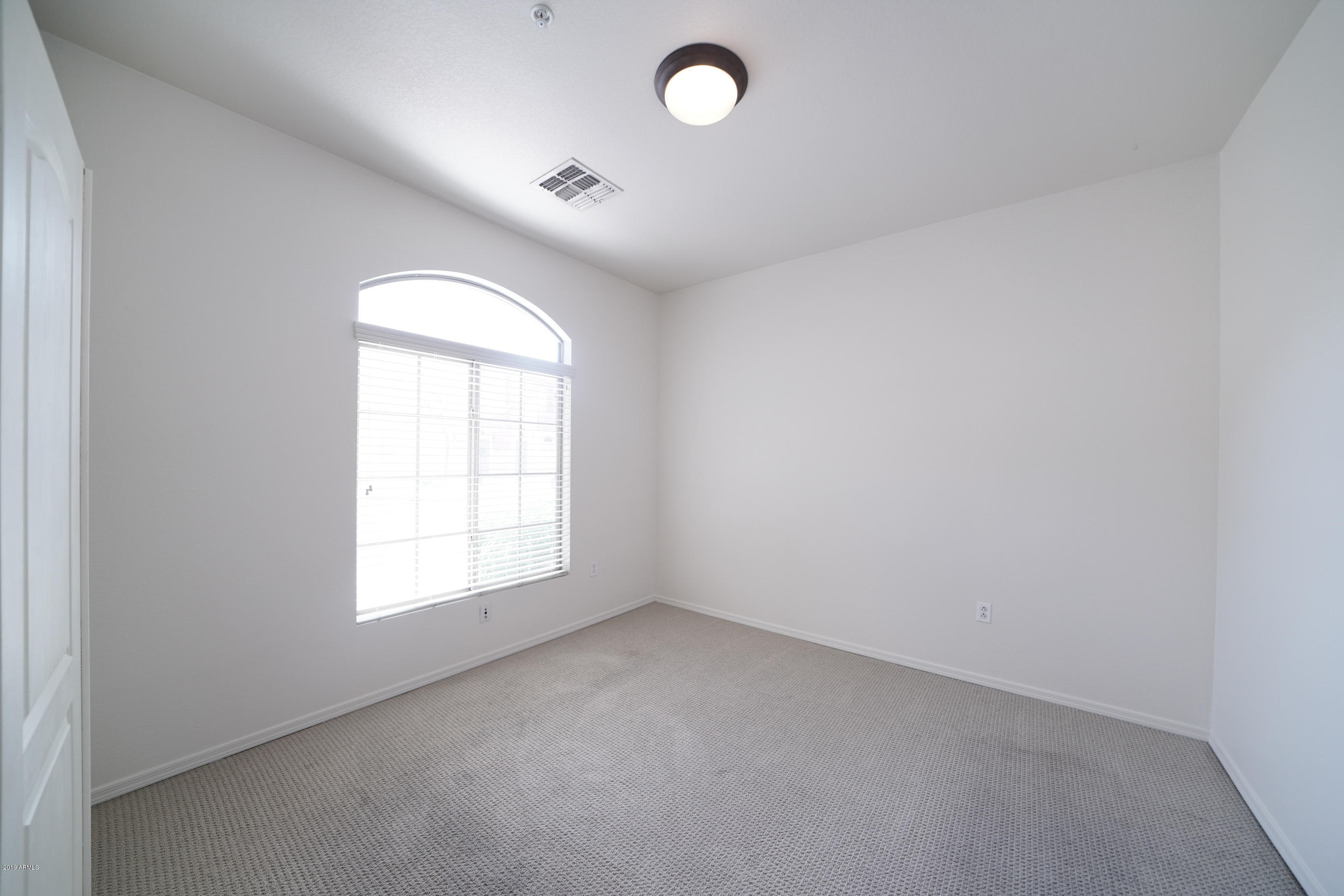 280 South Evergreen Road, Unit 1229 Tempe, AZ 85288 - Photo 10 of 31 an empty room with a window