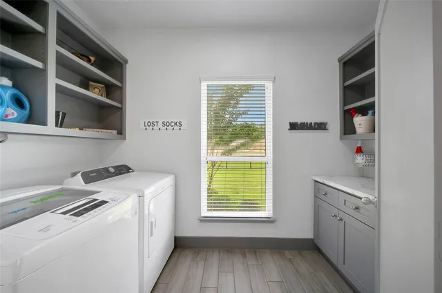 a living room with patio furniture and garden