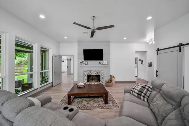 a living room with furniture and a rug