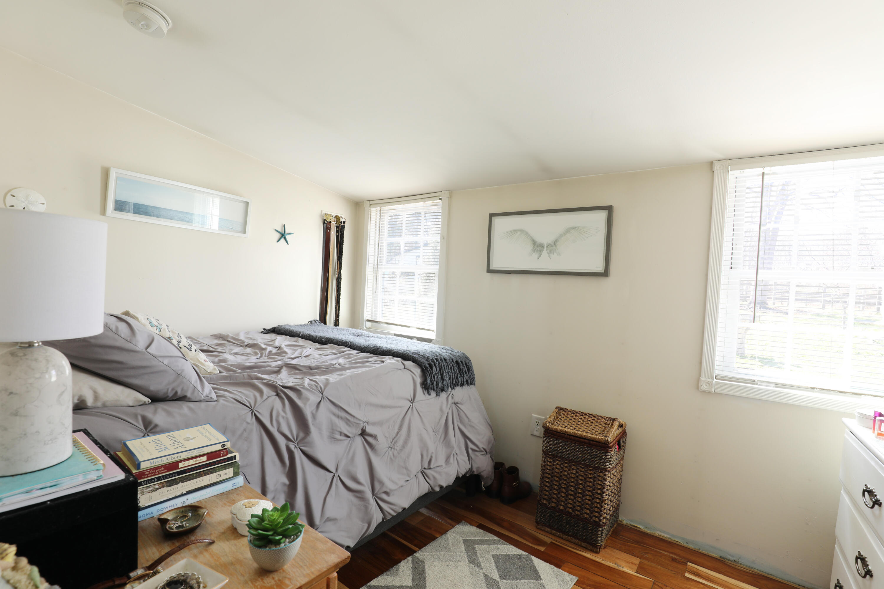 39 Lovell's Lane Mashpee, MA 02649 - Photo 20 of 24 a bedroom with a bed and wooden floor
