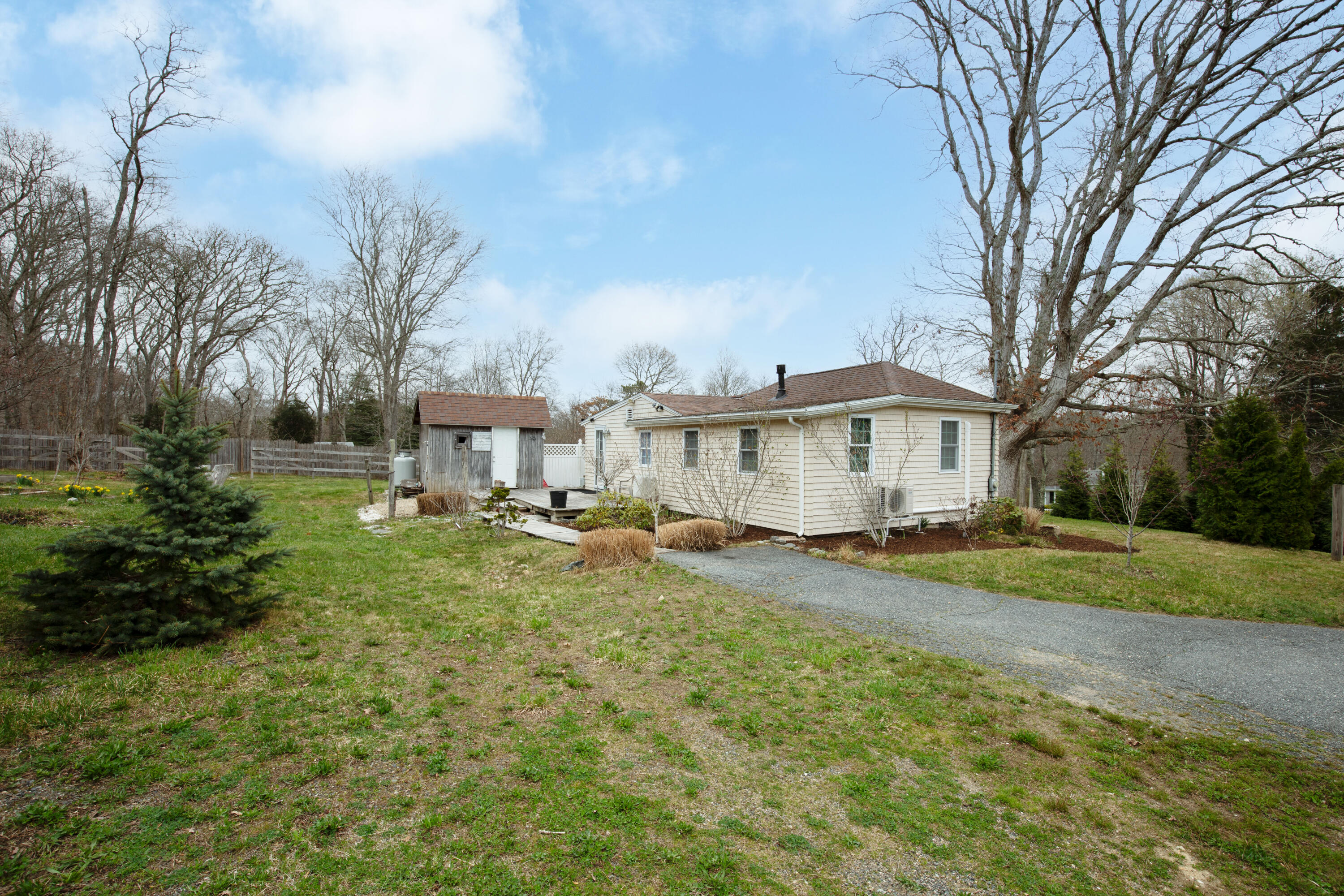 39 Lovell's Lane Mashpee, MA 02649 - Photo 23 of 24 a view of a town with barn house in the background