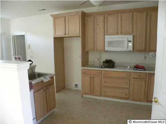 4 Tisdale Road Whiting, NJ 08759 - Photo 2 of 3 a kitchen with sink cabinets and stove