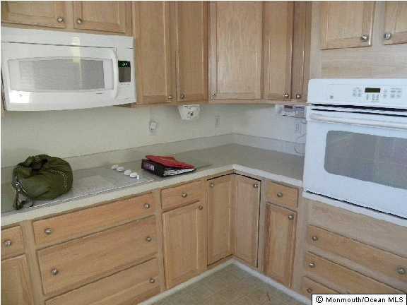 4 Tisdale Road Whiting, NJ 08759 - Photo 3 of 3 a kitchen with white cabinets and white appliances