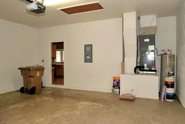 a view of a storage & utility room with two washing machine