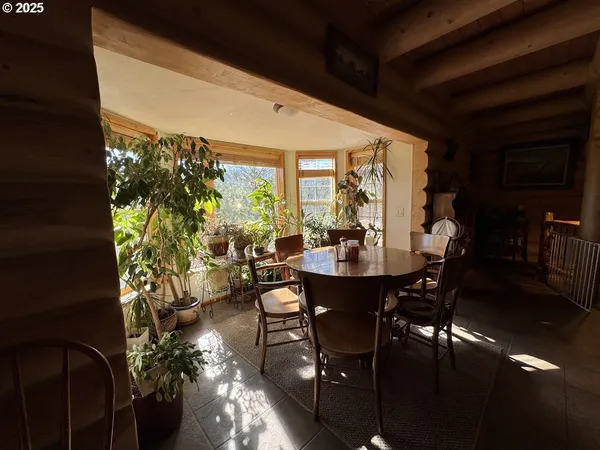 a view of a dining room with furniture window and outside view