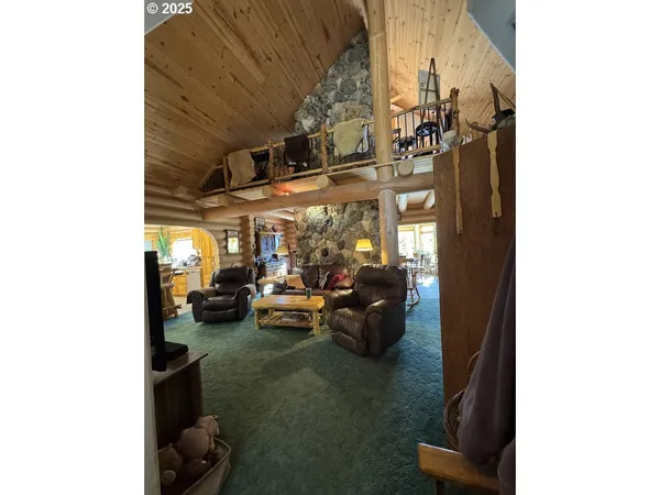 a view of living room with couch and chairs