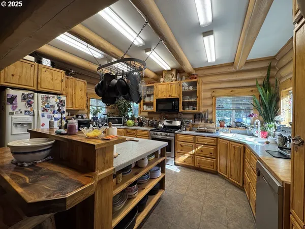 a view of a kitchen with appliances and cabinets