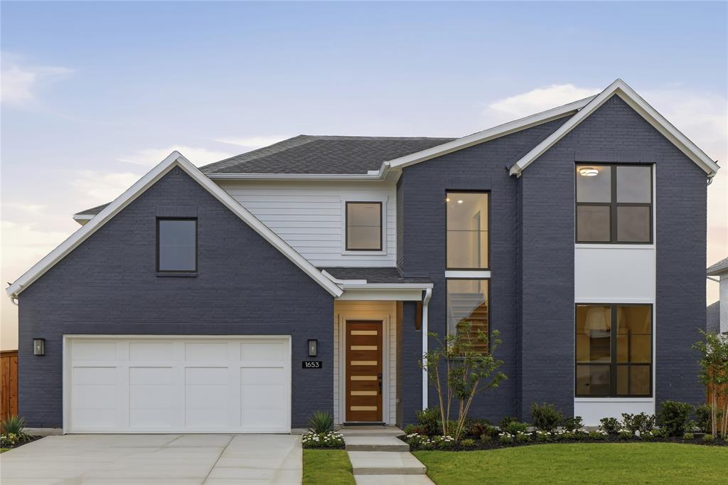 a front view of a house with yard