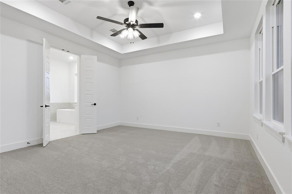 1653 Cedar Elm Way Burleson, TX 76028 - Photo 12 of 26 an empty room with a ceiling fan and a window
