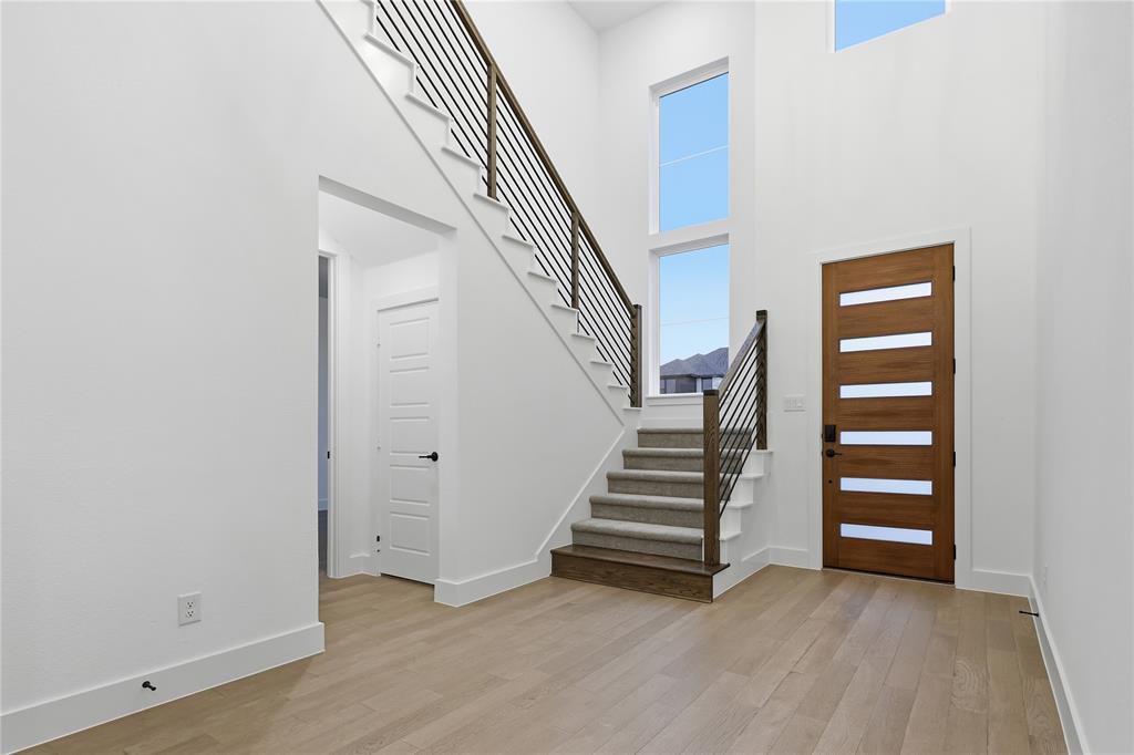 1653 Cedar Elm Way Burleson, TX 76028 - Photo 2 of 26 a view of room with stairs and a window