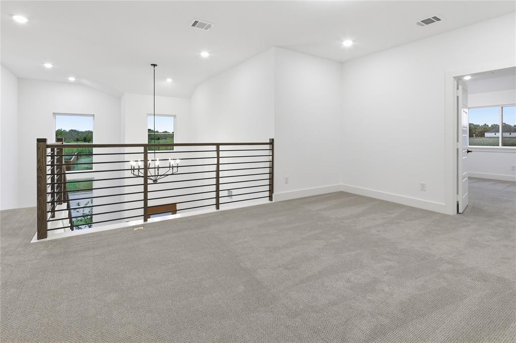 1653 Cedar Elm Way Burleson, TX 76028 - Photo 22 of 26 a view of an empty room with a kitchen