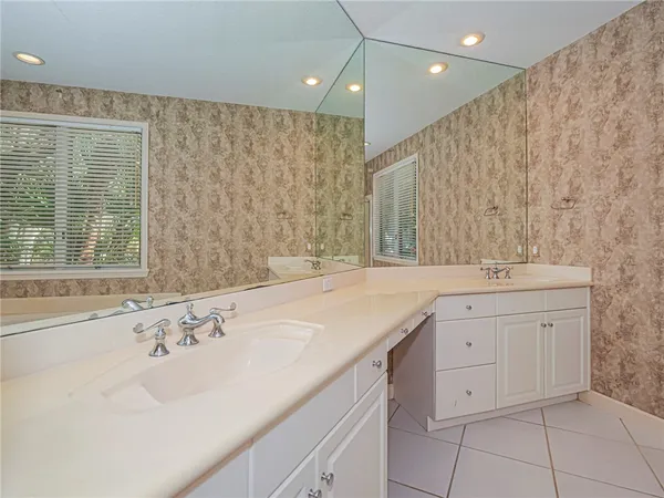 a bathroom with a sink double vanity and a bathtub