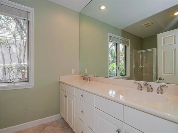 a bathroom with a sink and a window