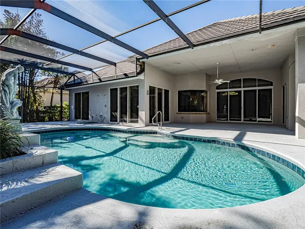 a view of a house with sitting area and garden