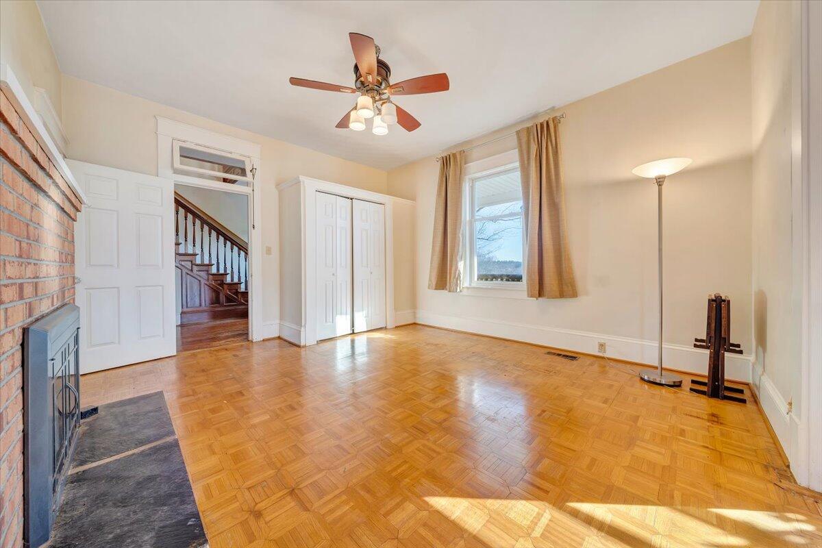 181 Chestnut Grove Road Callaway, VA 24067 - Photo 11 of 51 a view of a livingroom with wooden floor and staircase