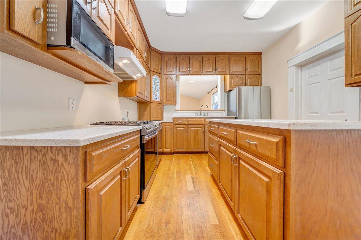 181 Chestnut Grove Road Callaway, VA 24067 - Photo 16 of 51 a kitchen with stainless steel appliances granite countertop a sink and cabinets
