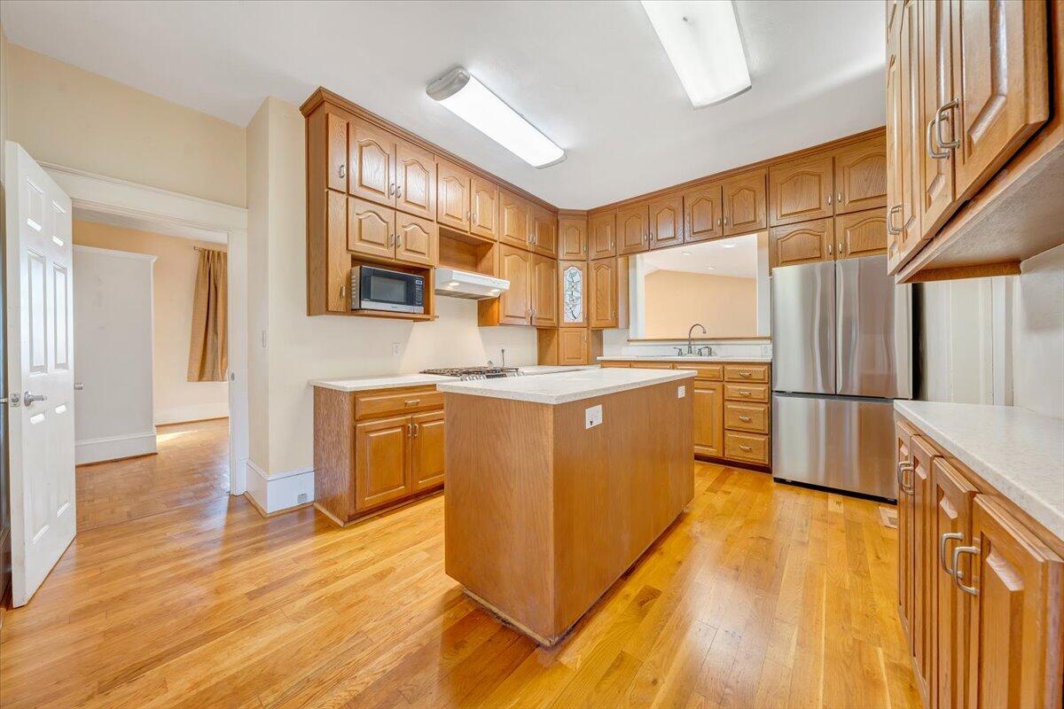 181 Chestnut Grove Road Callaway, VA 24067 - Photo 17 of 51 a kitchen with stainless steel appliances granite countertop a stove a sink and a refrigerator