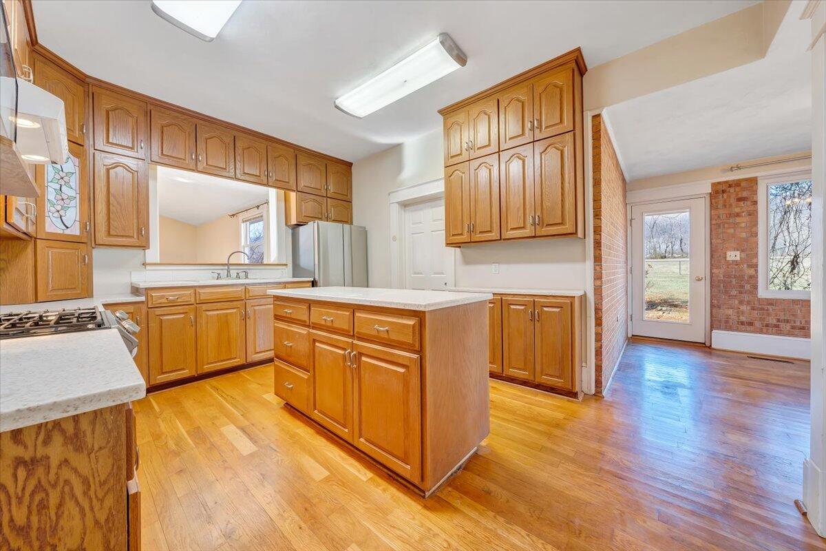 181 Chestnut Grove Road Callaway, VA 24067 - Photo 18 of 51 a kitchen with stainless steel appliances granite countertop a stove a sink and a refrigerator
