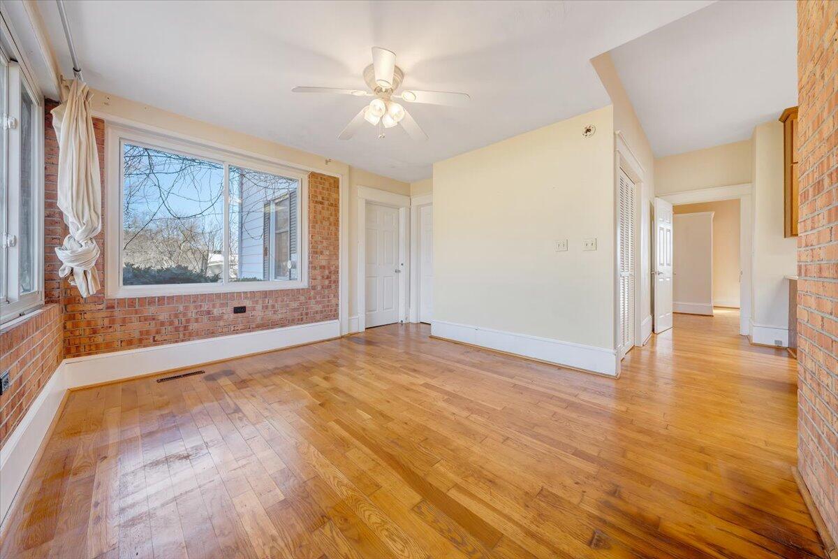 181 Chestnut Grove Road Callaway, VA 24067 - Photo 20 of 51 a view of an empty room with a window and wooden floor