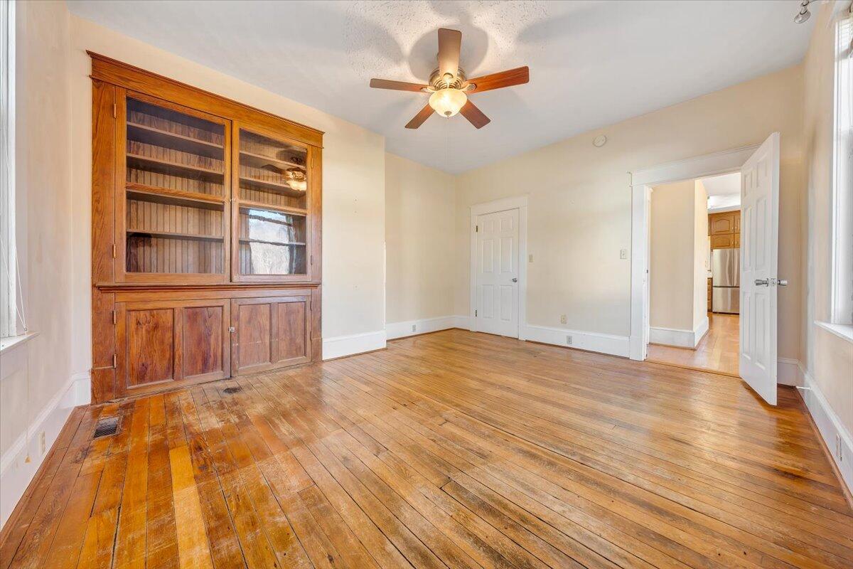 181 Chestnut Grove Road Callaway, VA 24067 - Photo 26 of 51 a view of an empty room with a window and wooden floor