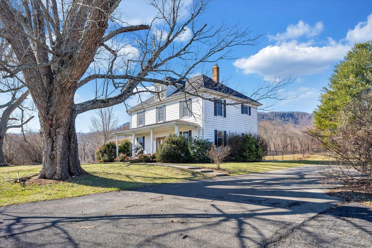 181 Chestnut Grove Road Callaway, VA 24067 - Photo 4 of 51 a view of yellow house with large trees
