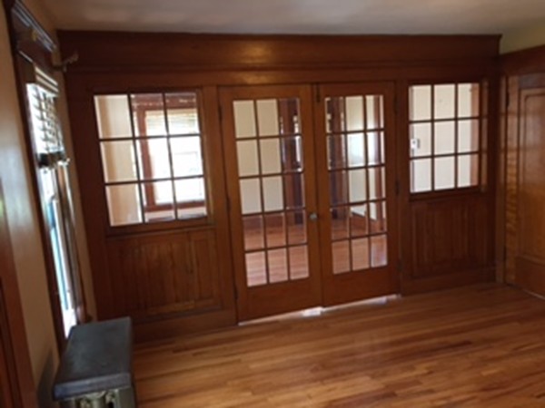 15-17 Windemere Street Springfield, MA 01104 - Photo 4 of 9 wooden floor in an empty room with a window